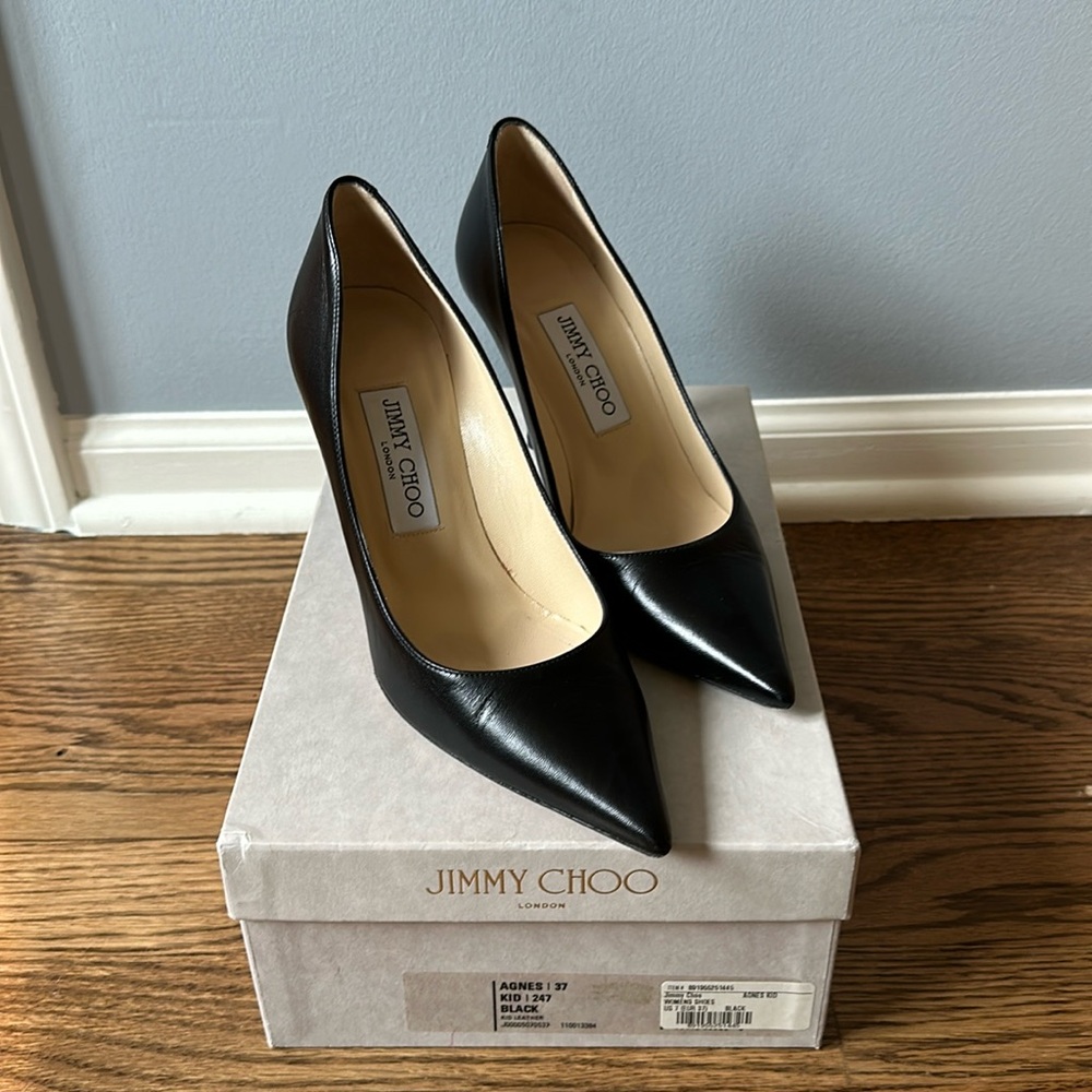 Jimmy choo black heals size 37. Only wore 2 times. Still have box.